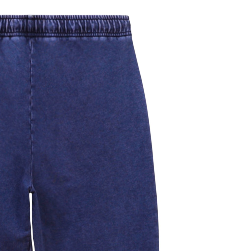 Jogger délavé jambe droite femme avec poches plaquées